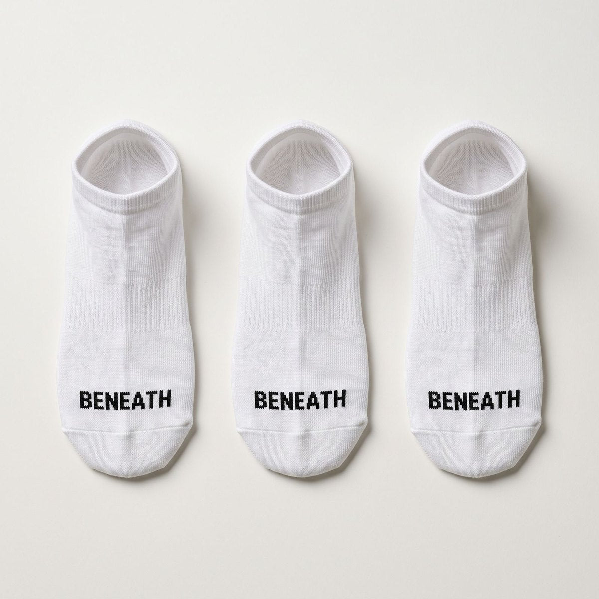 Three pairs of white BENEATH low-cut socks